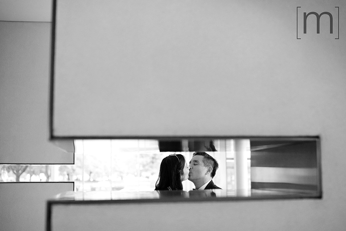 a photo of a couple kissing at a wedding at st james cathedral centre toronto